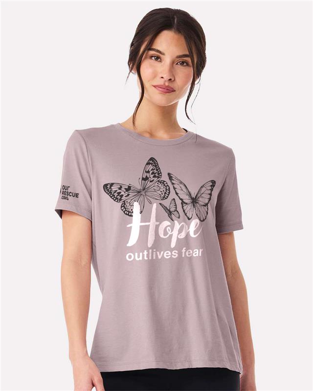 Woman wearing a gray t-shirt with butterfly design and text on a white background
