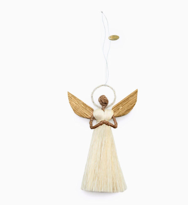 Decorative angel ornament with wooden wings and a white tassel skirt on a white background