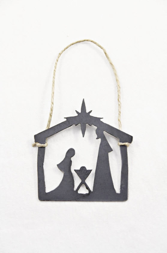 Decorative nativity scene silhouette hanging ornament on a white background