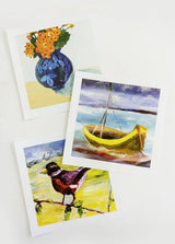 Three painted cards featuring a boat, flowers, and a bird on a white background