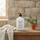 Hand lotion bottle with motivational quote on a white background