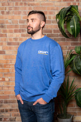 male model blue crew neck sweatshirt o.u.r logo