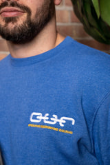 male model blue crew neck sweatshirt o.u.r logo close up
