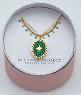 green pendant layered gold necklace