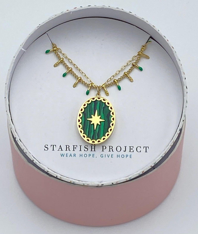 green pendant layered gold necklace